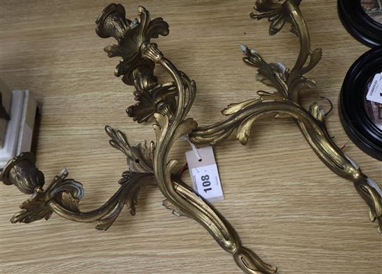 A pair of rococo style ormolu wall lights height 33cm